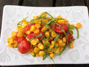 Isn't this a pretty dish to set before...well...anyone? Roasted corn and tomatoes with basil.