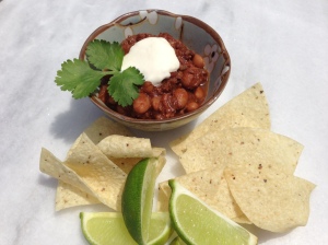 This Beef, Bacon and Chocolate Chili is great with sour cream, cilantro, lime wedges and...of course...tortilla chips
